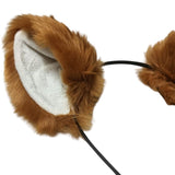 Close-up view of a caramel-colored fox or cat ear, featuring soft faux fur on the outer part and a light cream inner ear. Attached to a black metal headband. Displayed on a white background.