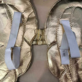 Gold wings with wide white elastic to attach.
