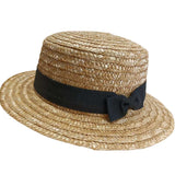 Boater hat straw with black band with bow.