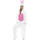 Front view of the Bunny Adult Costume worn by a woman, featuring a white fluffy jumpsuit with a pink tummy panel and an attached hood designed with a bunny face and pink ears.