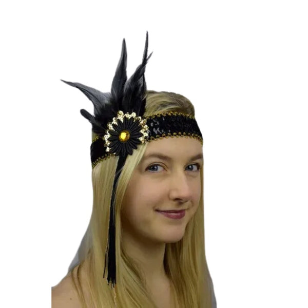 Flapper headband in black and gold trimmed with feathers and tassels.