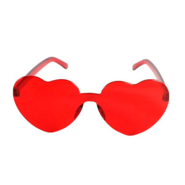 Heart-shaped pink Perspex party glasses. Description: These vibrant party glasses are crafted from red Perspex material, forming a whimsical heart shape. The transparent red color adds a playful touch, making them the perfect accessory for festive occasions, colour red.